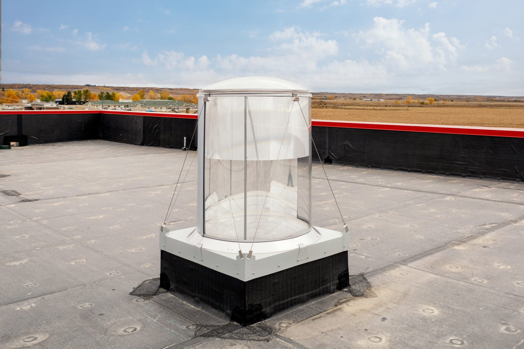 a white and black structure sitting on top of a roof - Dunseith Emergency Response