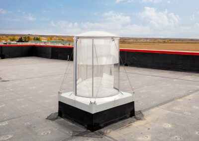 a white and black structure sitting on top of a roof - Dunseith Emergency Response