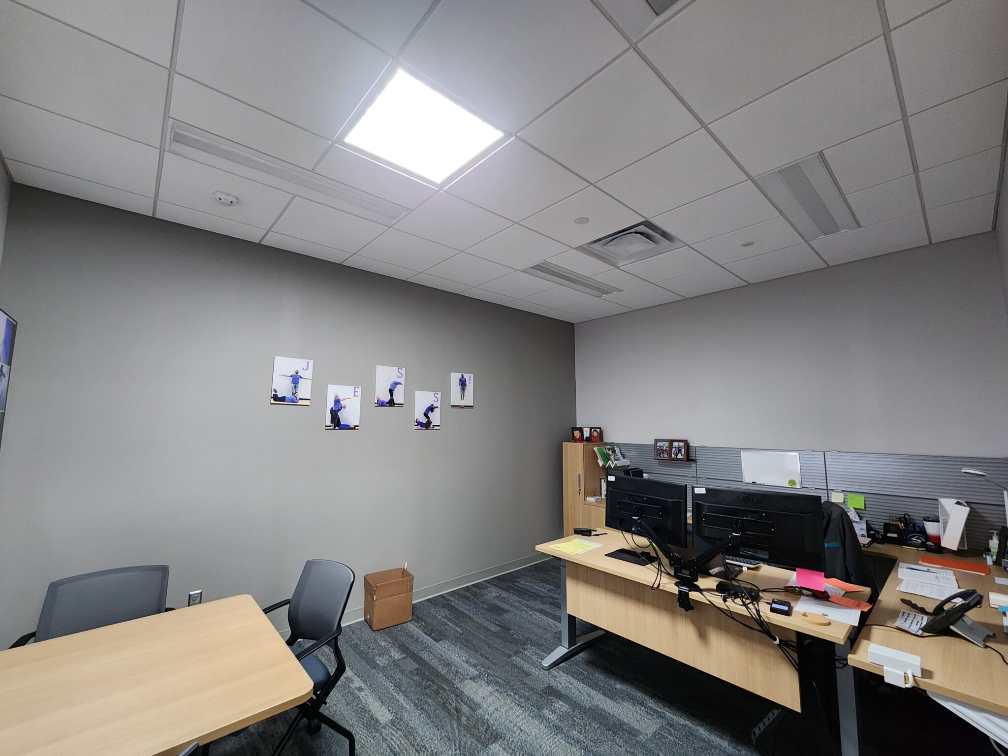 a room with a desk and a computer monitor - City of Plymouth Community Center Project