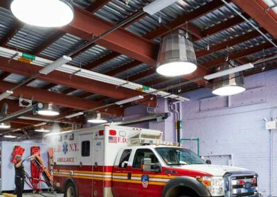 a fire truck parked inside of a garage - commercial skylight installation