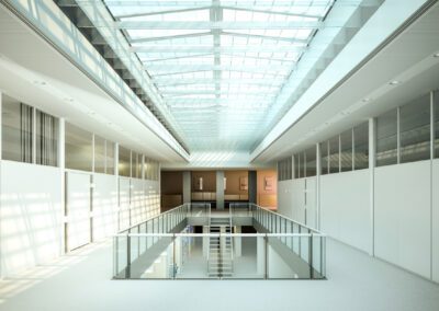 a large room with a glass ceiling and white walls - commercial skylights