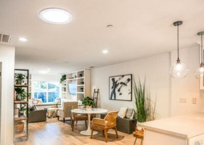 a kitchen and living room area of a home - natural daylighting systems